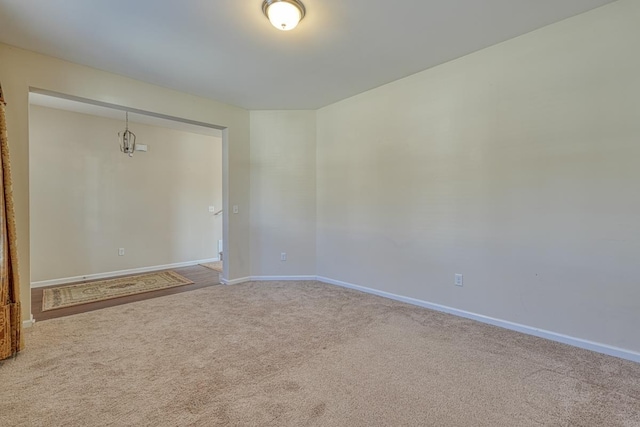 unfurnished room with carpet flooring