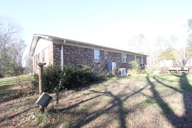 back of house with a lawn