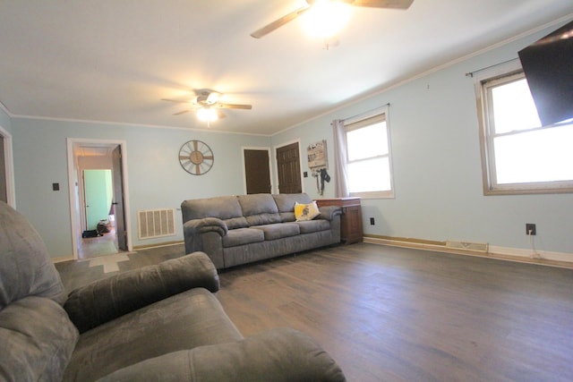 living room featuring crown molding, hardwood / wood-style floors, and ceiling fan