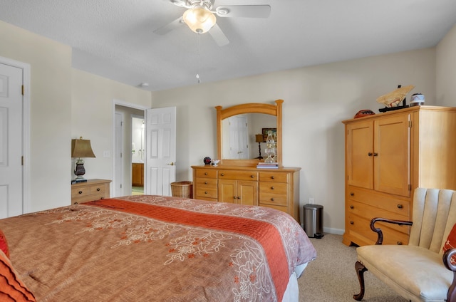 bedroom with ceiling fan and light carpet