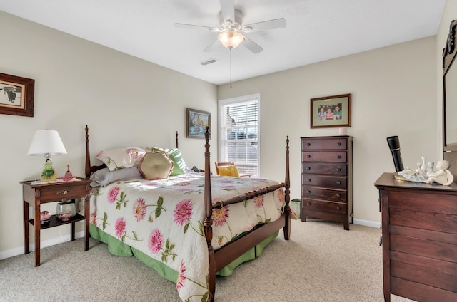 bedroom with ceiling fan and light colored carpet