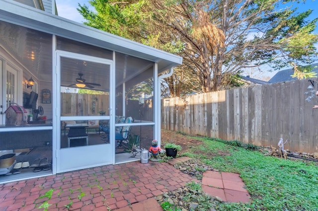 view of patio featuring a sunroom