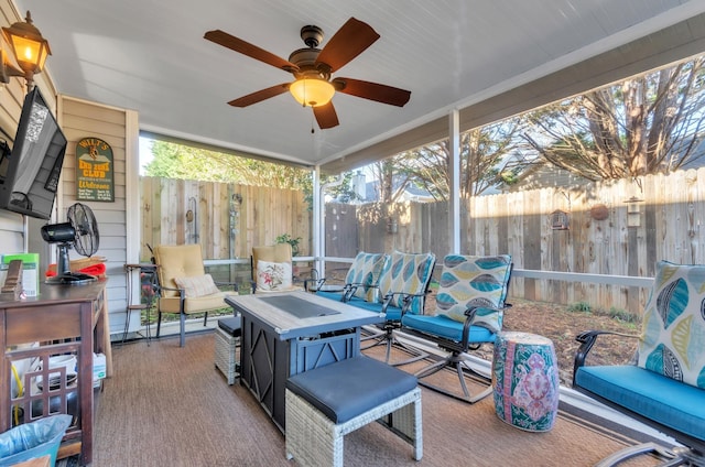 sunroom featuring ceiling fan