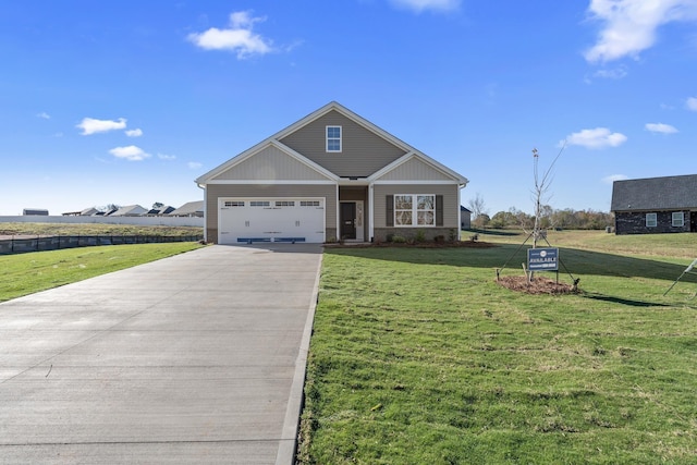 view of front facade featuring a garage and a front lawn