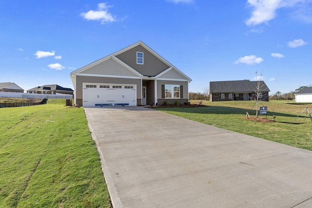 craftsman house featuring a front lawn and a garage