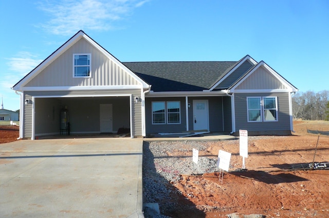 view of front of property with secured water heater and a garage