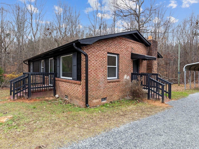 view of home's exterior featuring a carport