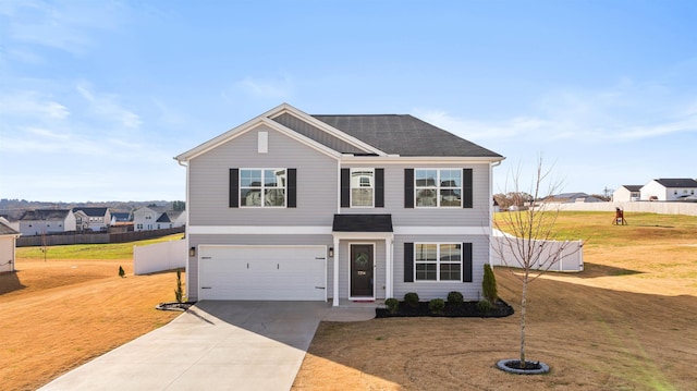 view of front facade featuring a front lawn and a garage