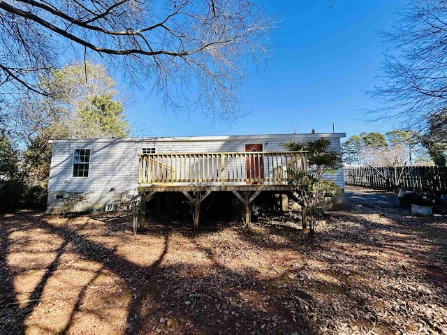 back of property featuring a wooden deck