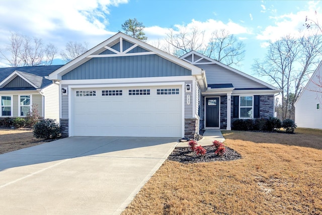 craftsman-style home with a front yard and a garage