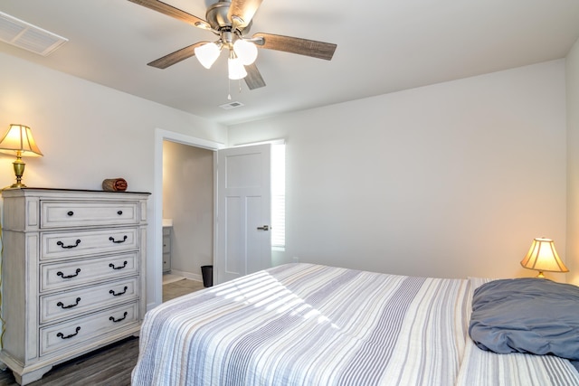 bedroom with ceiling fan and dark wood-type flooring