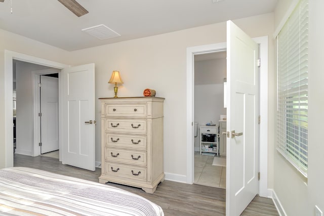 bedroom with hardwood / wood-style flooring and ceiling fan