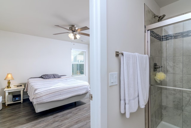 bedroom with hardwood / wood-style flooring and ceiling fan