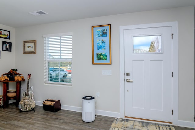 foyer entrance with dark hardwood / wood-style floors