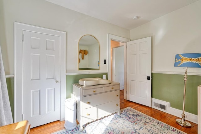 bedroom with light hardwood / wood-style floors