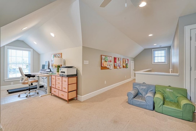 office space featuring plenty of natural light, carpet floors, and vaulted ceiling