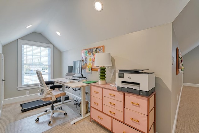 office area featuring light carpet and vaulted ceiling