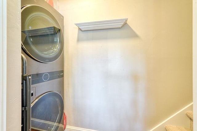 laundry room with stacked washing maching and dryer