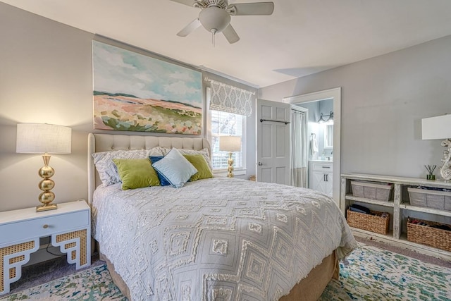 bedroom with ceiling fan and ensuite bath