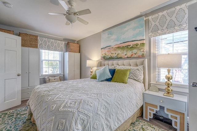 carpeted bedroom featuring ceiling fan