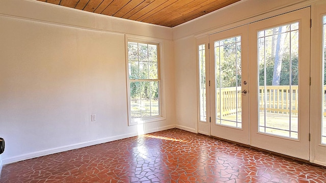 entryway featuring a healthy amount of sunlight, french doors, and wooden ceiling