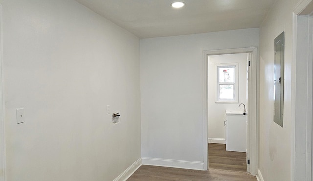 laundry area with wood-type flooring and sink