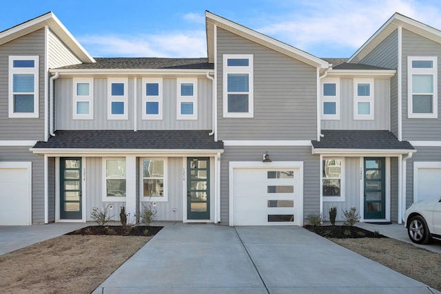 townhome / multi-family property featuring a garage