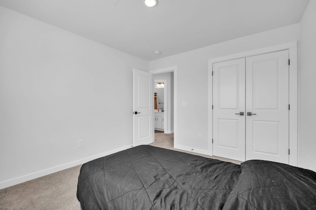 unfurnished bedroom with a closet and dark colored carpet