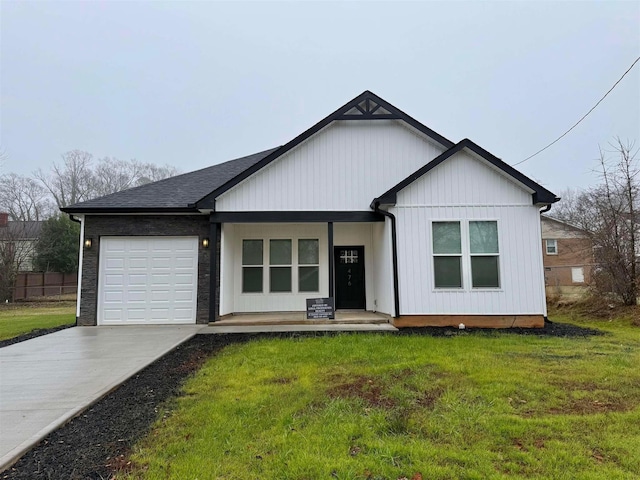 view of front of house with a front lawn and a garage