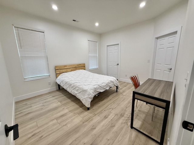 bedroom with light hardwood / wood-style flooring