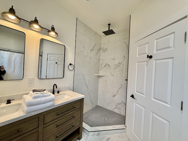 bathroom with vanity and tiled shower