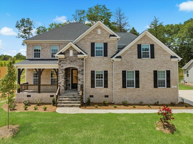 view of front of house with a porch and a front yard