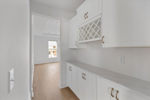 hall with light hardwood / wood-style flooring