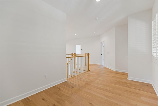 hall with light hardwood / wood-style flooring