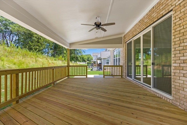 wooden deck featuring ceiling fan