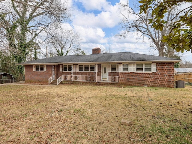 view of front of property with a front lawn and cooling unit