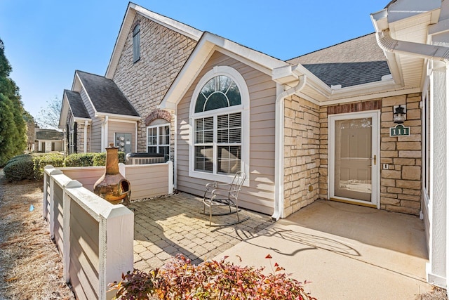 back of property featuring a patio