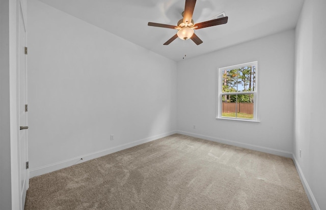 carpeted empty room with ceiling fan