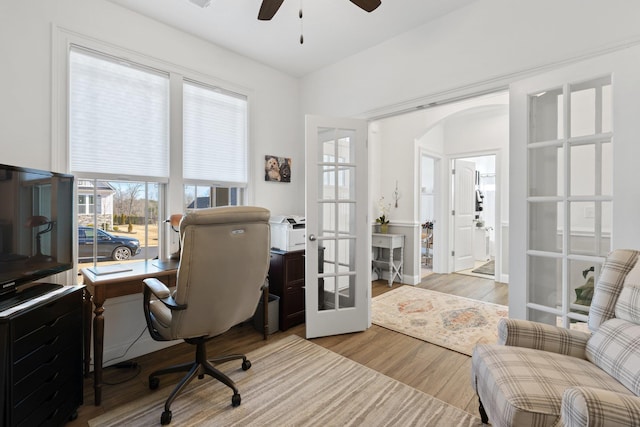 office featuring ceiling fan, french doors, and light wood-type flooring