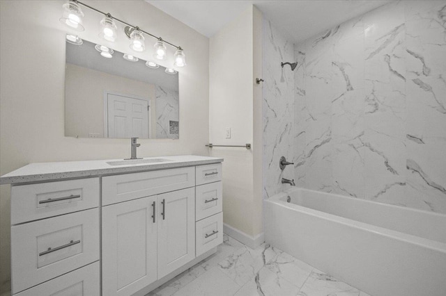 bathroom with tiled shower / bath combo and vanity