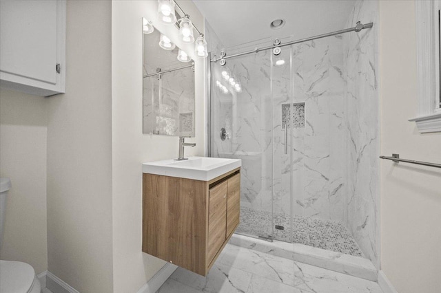 bathroom with vanity, an enclosed shower, and toilet