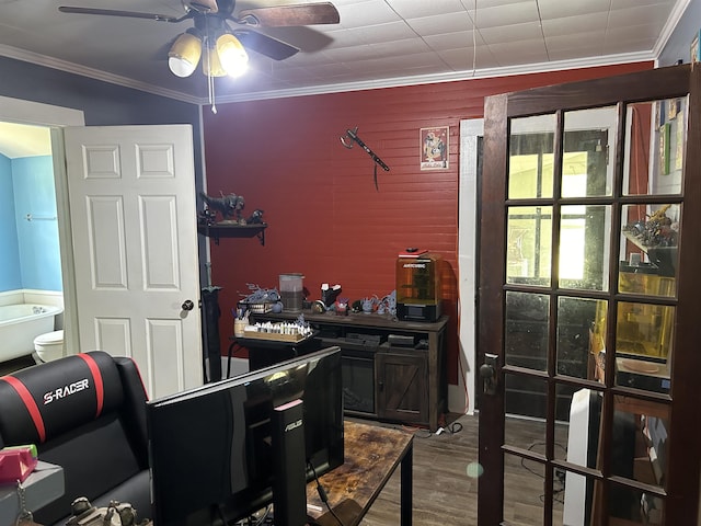 interior space with hardwood / wood-style floors, ceiling fan, and crown molding