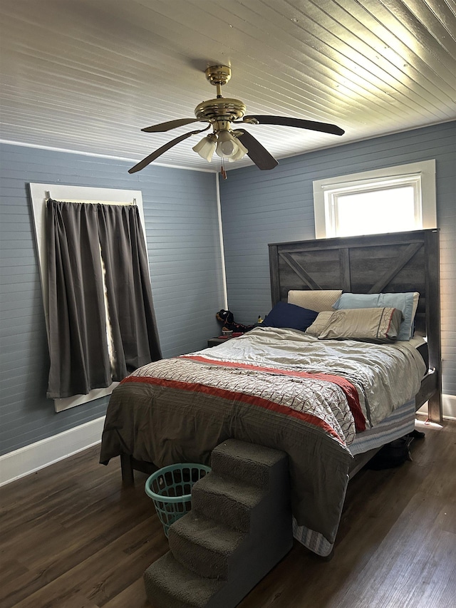 bedroom featuring ceiling fan and dark hardwood / wood-style flooring