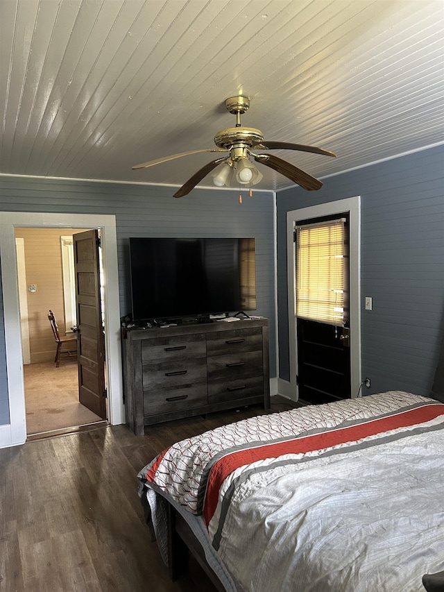 bedroom with ceiling fan and dark hardwood / wood-style flooring