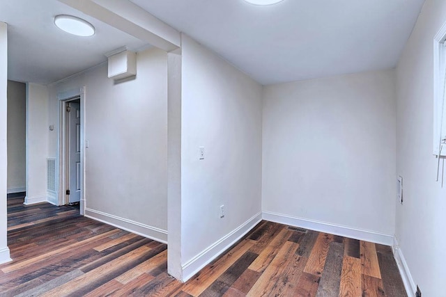 additional living space featuring dark hardwood / wood-style flooring