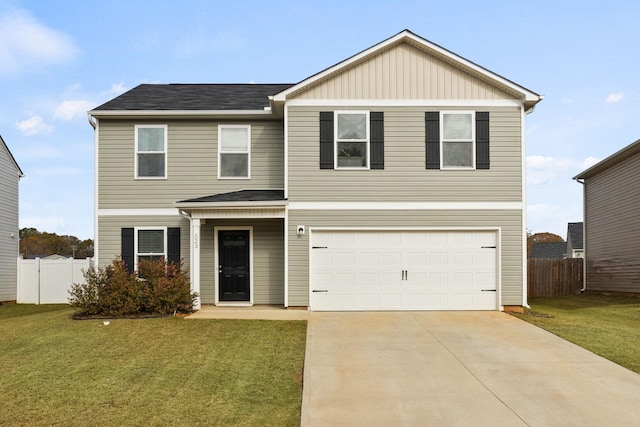 front facade featuring a front yard and a garage