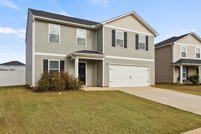 view of front of property with a garage and a front lawn