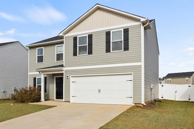 view of front of home with a garage and a front lawn