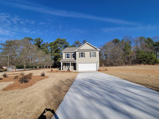 view of front of home featuring covered porch and a garage