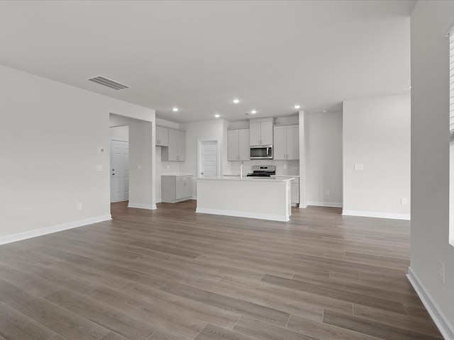 unfurnished living room with light hardwood / wood-style flooring